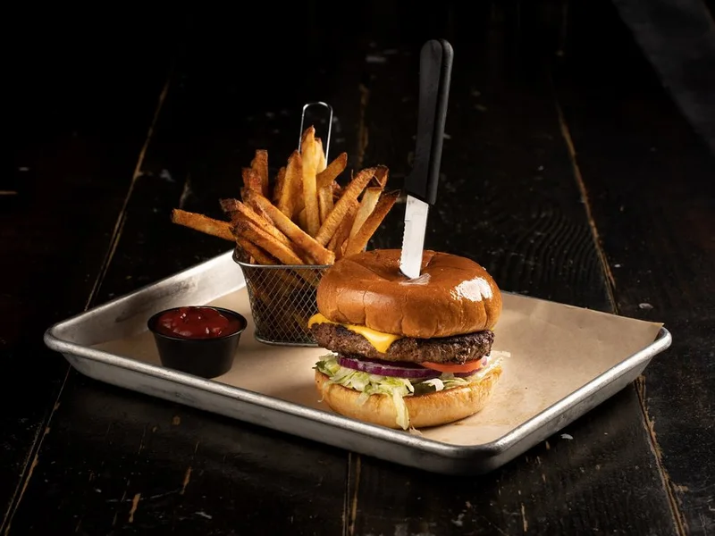 The Classic Blu Burger with American cheese, lettuce and tomato