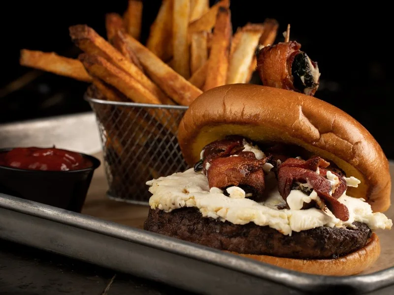 Fire in the Hole burger with cream cheese, bacon and a bacon-wrapped jalapeno
