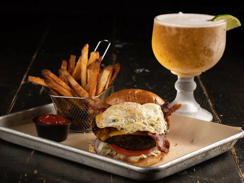 The Hangover Burger topped with a fried egg and bacon