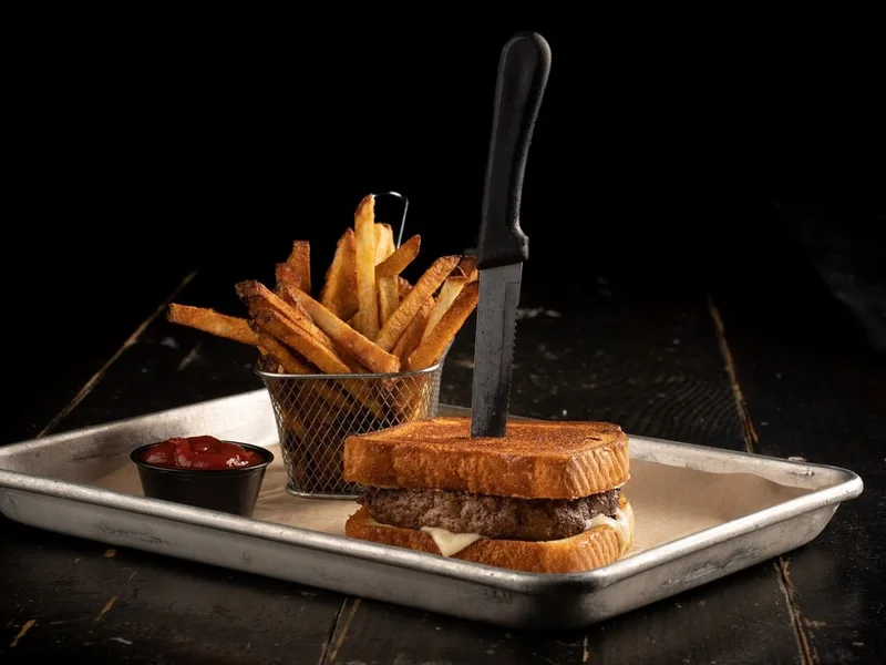 The Patty Melt on grilled Texas toast with a basket of fries