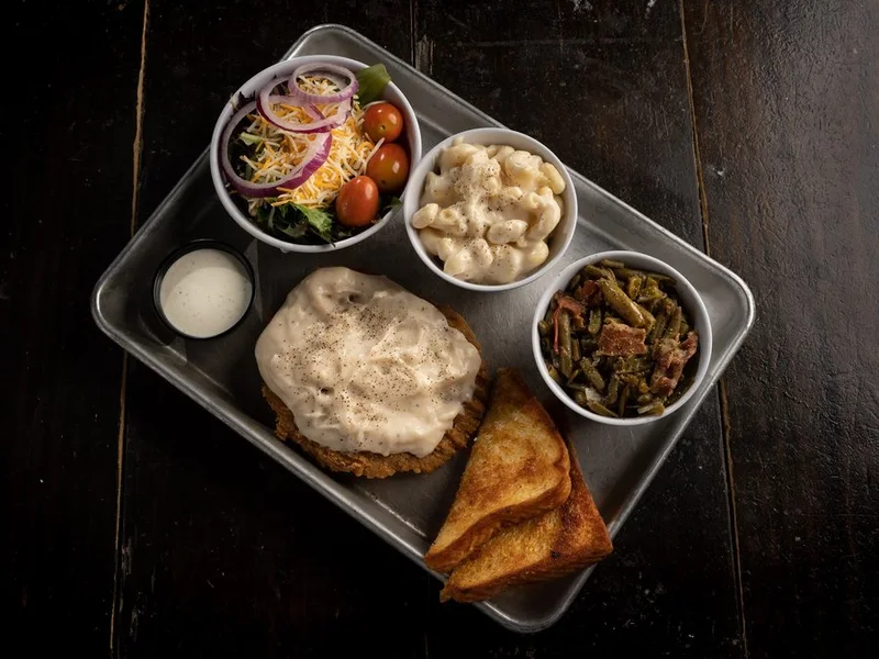 Country fried steak smothered in white gravy
