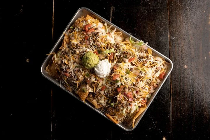 Ultimate Nachos on a steel tray