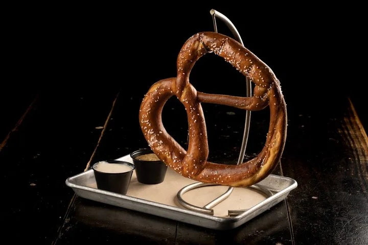 Giant pretzel served on a stand