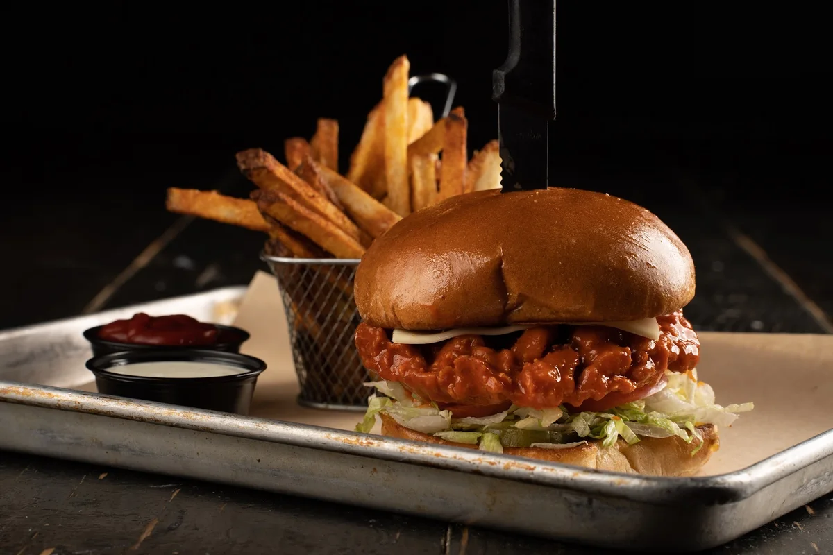 Buffalo chicken sandwich, fried cutlet in buffalo sauce on a brioche bun