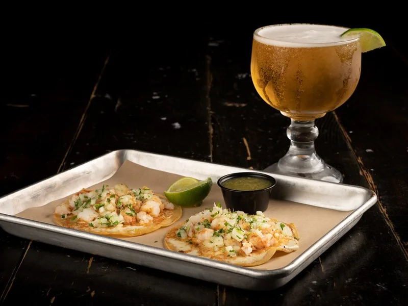 Shrimp tacos on soft tortillas with lime